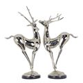 A PAIR OF NICKEL PLATED BRONZE DEER