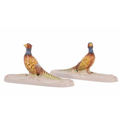 A PAIR OF PORCELAIN PAPERWEIGHTS