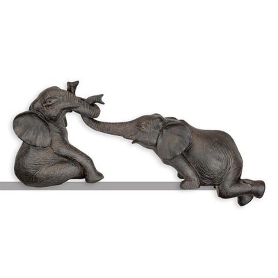 A PAIR OF RESIN ELEPHANTS