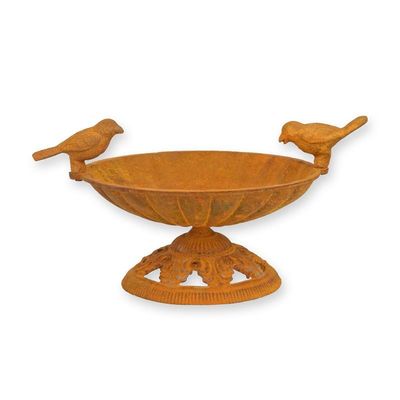 A PAIR OF RUSTY CAST IRON BIRD BATHS