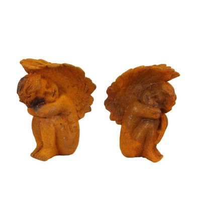 A PAIR OF RUSTY CAST IRON PUTTI BOOK-ENDS