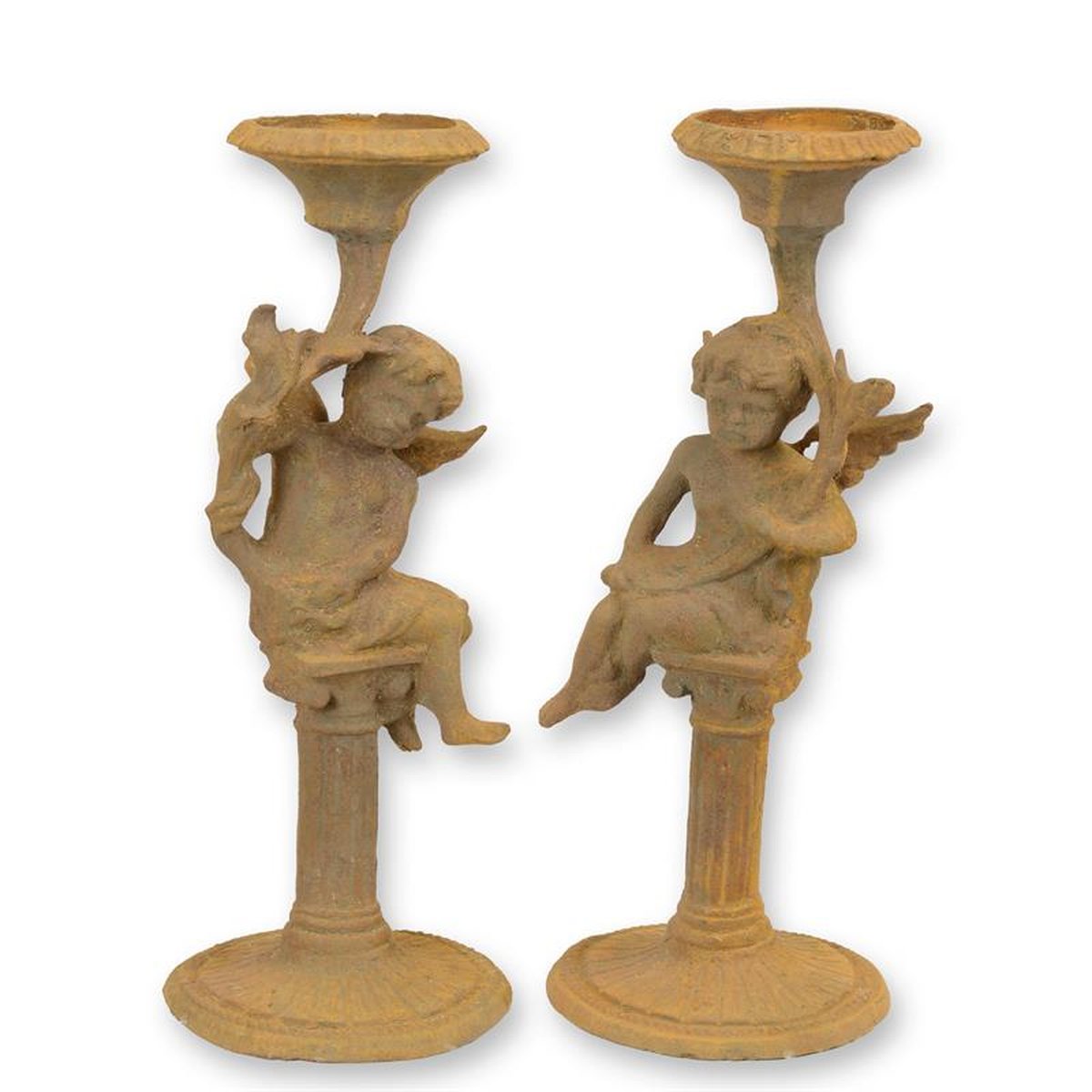 A PAIR OF RUSTY CAST IRON PUTTI CANDLESTANDS