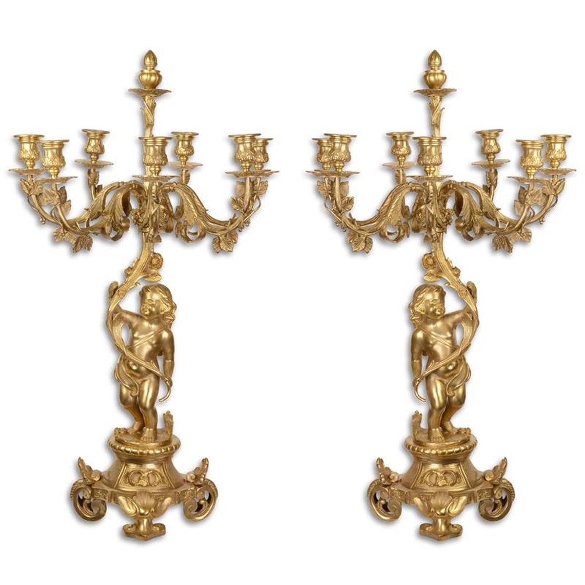 A PAIR OF SEVEN LIGHT GILT CANDELABRA