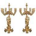 A PAIR OF SEVEN LIGHT GILT CANDELABRA