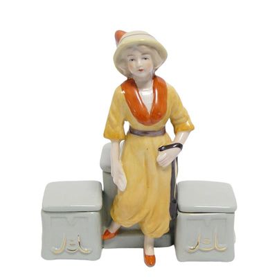 A PORCELAIN DOUBLE MUSTARD POT