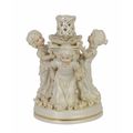 A PORCELAIN FIGURAL CANDLE STICK