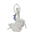 A PORCELAIN FIGURINE OF A DANCER