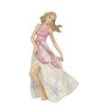 A PORCELAIN FIGURINE OF A DANCER