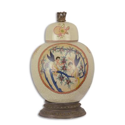 A PORCELAIN JAR AND COVER ON BRASS BASE