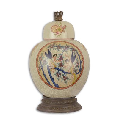 A PORCELAIN JAR AND COVER ON BRASS BASE