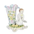 A PORCELAIN SWAN AND CHERUB VASE