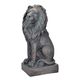 A RESIN AND MGO SCULPTURE OF A SITTING LION - OLD BLACK