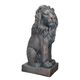 A RESIN AND MGO SCULPTURE OF A SITTING LION - OLD BLACK