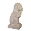 A RESIN AND MGO SCULPTURE OF A SITTING LION