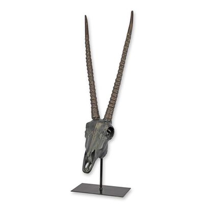 A RESIN CHINKARA OR INDIAN GAZELLE SKULL ON STAND
