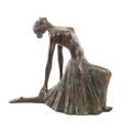 A RESIN FIGURINE OF A BALLERINA