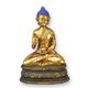 A RESIN FIGURINE OF A BUDDHA