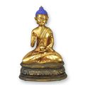 A RESIN FIGURINE OF A BUDDHA