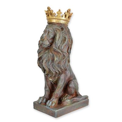 A RESIN FIGURINE OF A CROWNED LION
