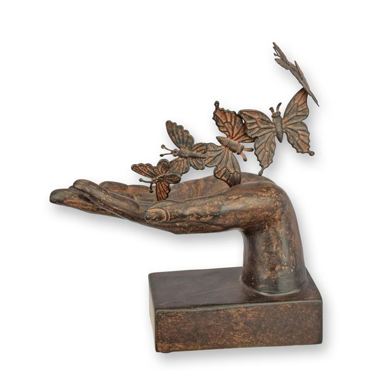 A RESIN FIGURINE OF A HAND WITH BUTTERFLIES