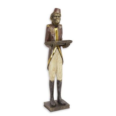 A RESIN FIGURINE OF A MONKEY BUTTLER