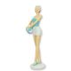 A RESIN FIGURINE OF A RETRO BEACH GIRL