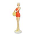 A RESIN FIGURINE OF A RETRO BEACH GIRL