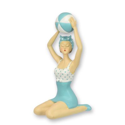 A RESIN FIGURINE OF A RETRO BEACH GIRL