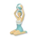 A RESIN FIGURINE OF A RETRO BEACH GIRL
