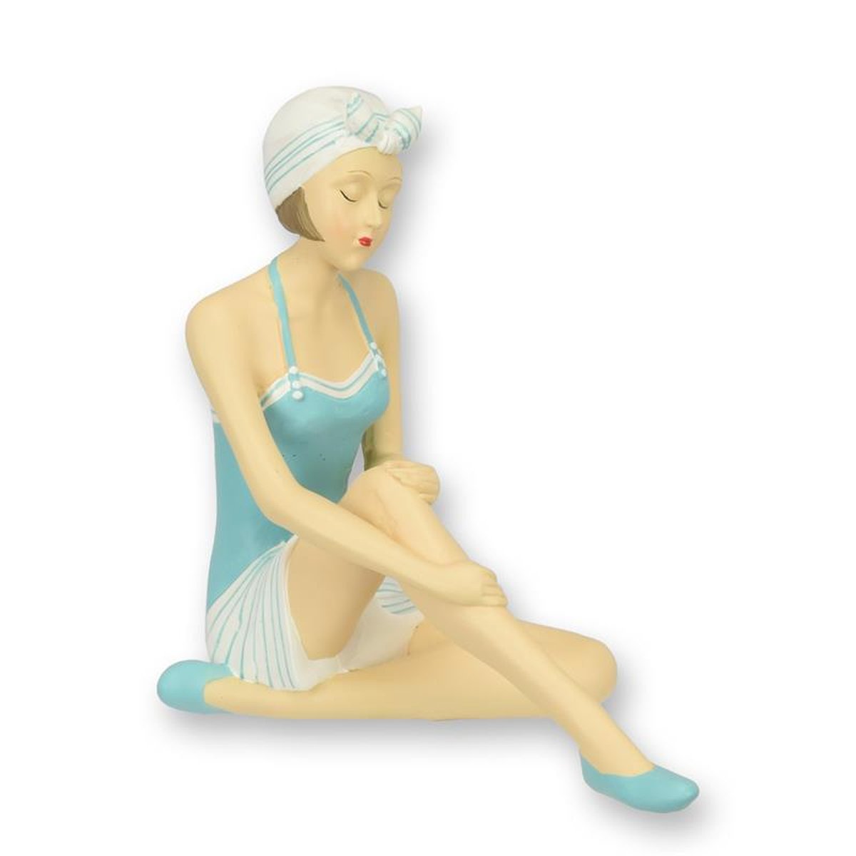 A RESIN FIGURINE OF A RETRO BEACH GIRL