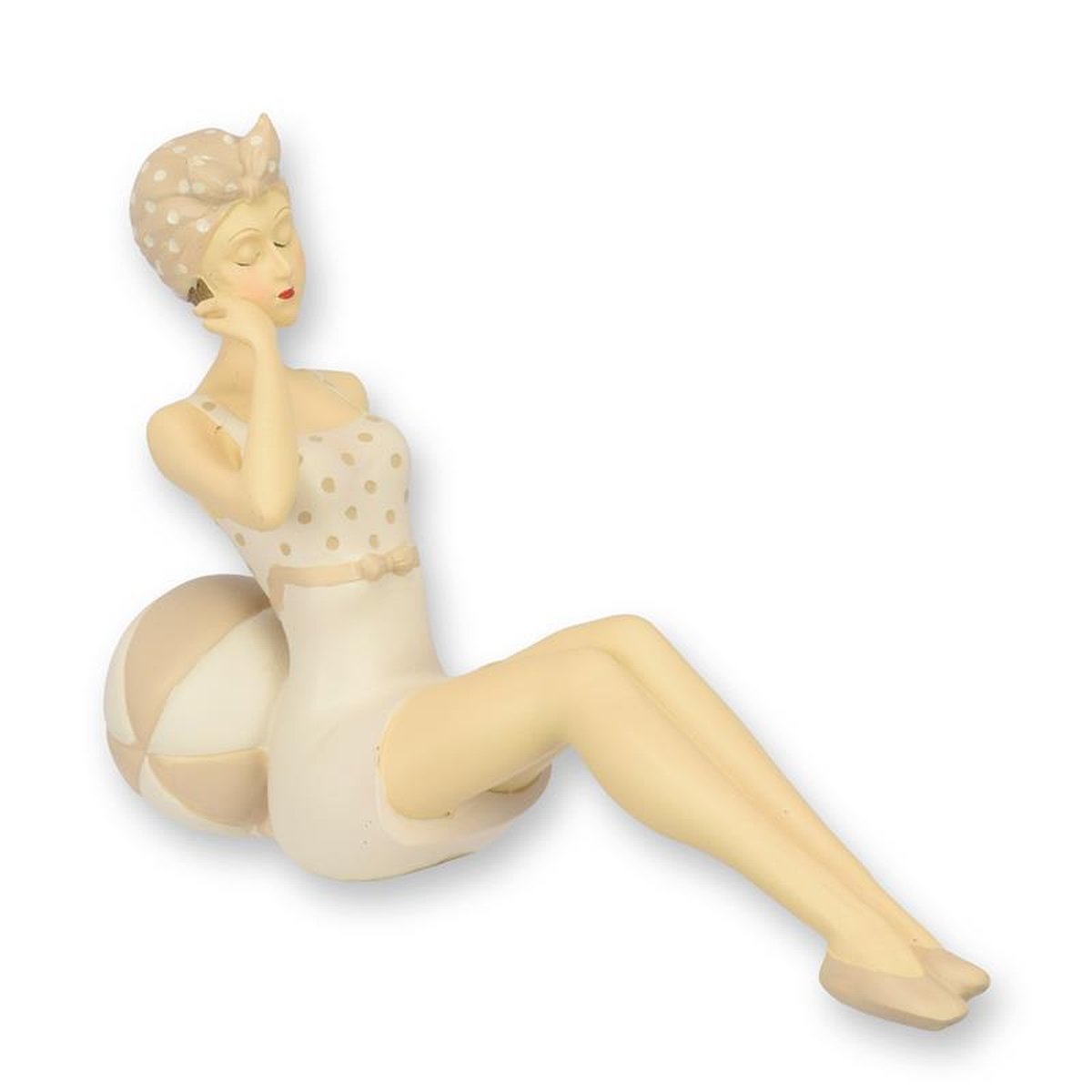 A RESIN FIGURINE OF A RETRO BEACH GIRL