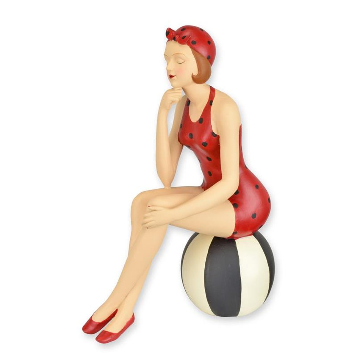A RESIN FIGURINE OF A RETRO BEACH GIRL