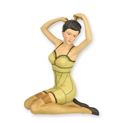 A RESIN FIGURINE OF A RETRO PIN-UP GIRL