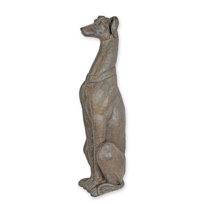 A RESIN FIGURINE OF A SITTING GREYHOUND