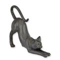 A RESIN FIGURINE OF A STRETCHING CAT