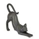 A RESIN FIGURINE OF A STRETCHING CAT