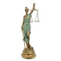 A RESIN FIGURINE OF LADY JUSTICE