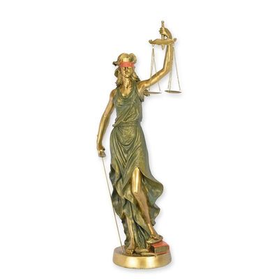 A RESIN FIGURINE OF LADY JUSTICE