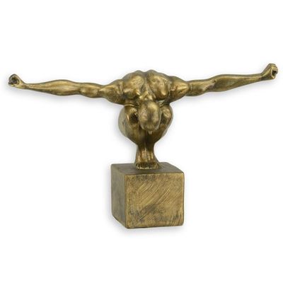 A RESIN FIGURINE OF THE OLYMPIAN MAN