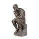 A RESIN FIGURINE OF THE THINKER""