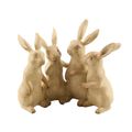 A RESIN GROUP OF 4 BUNNIES