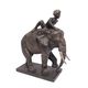 A RESIN GROUP OF AN ELEPHANT WITH RIDER