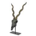 A RESIN IMPALA SKULL ON STAND
