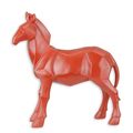A RESIN POLYGONAL FIGURINE OF A HORSE, RED
