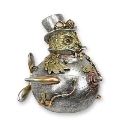 A RESIN STEAMPUNK FIGURINE OF AN OWL IN AN AIRCRAFT