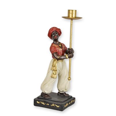 A RESIN VASSAL CANDLE HOLDER