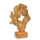 A RUSTY CAST IRON BUST OF A KISSING COUPLE