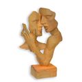 A RUSTY CAST IRON BUST OF A KISSING COUPLE