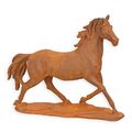 A RUSTY CAST IRON FIGURINE OF A HORSE