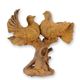 A RUSTY CAST IRON FIGURINE OF A PAIR OF PIGEONS ON BRANCH